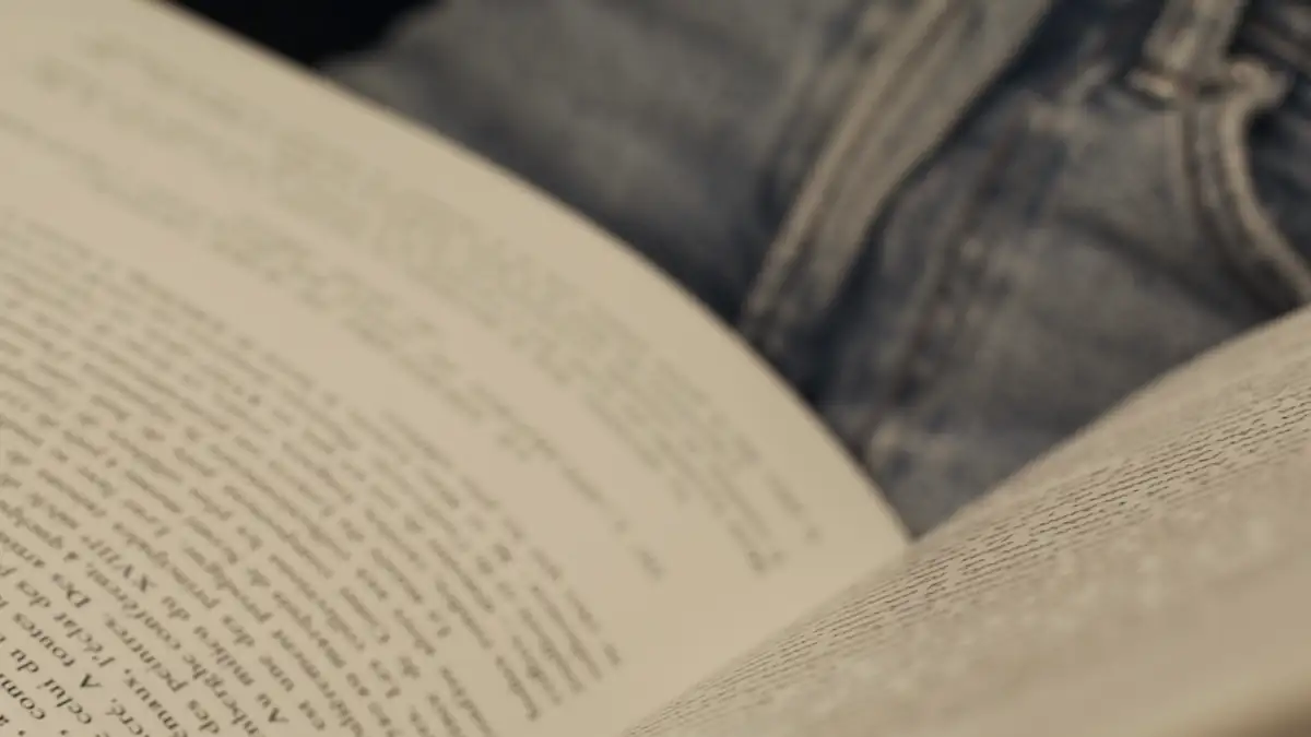 Hands turning the pages of a book