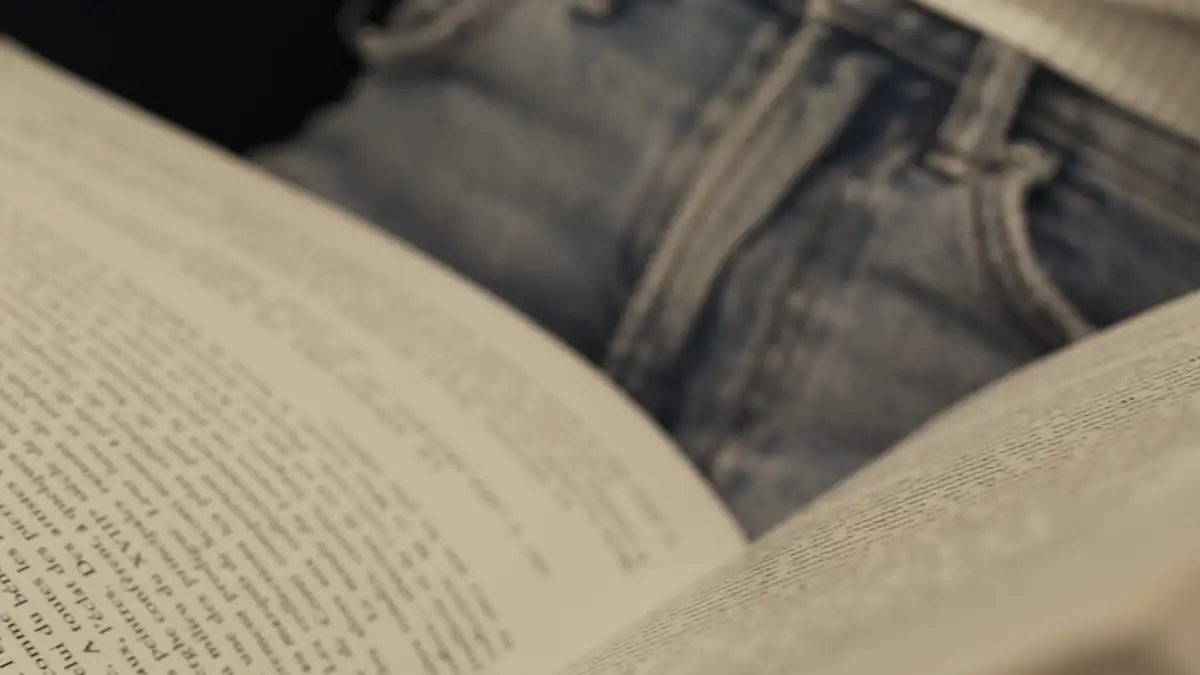 Hands turning the pages of a book