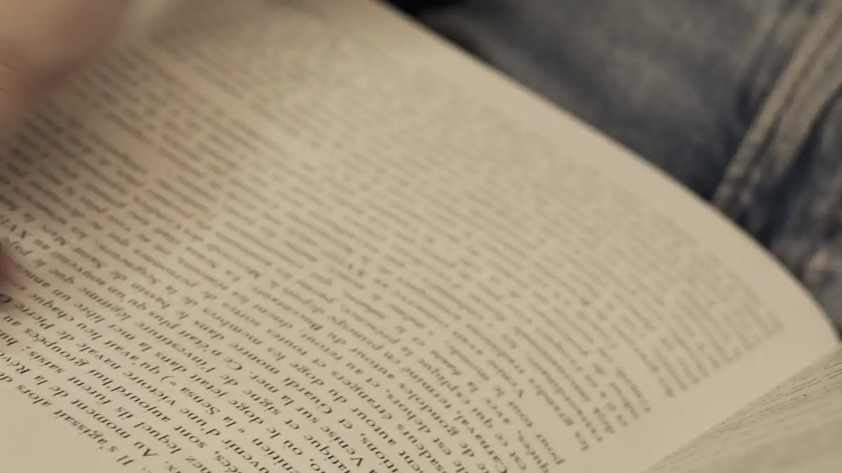 Hands turning the pages of a book
