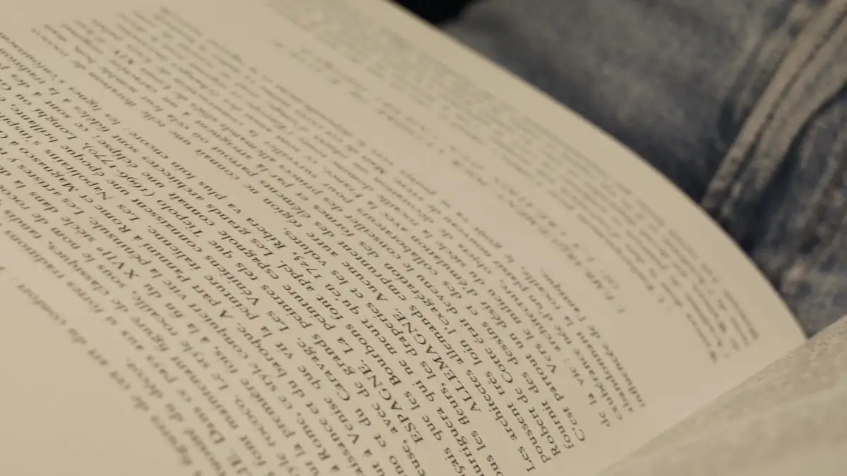 Hands turning the pages of a book