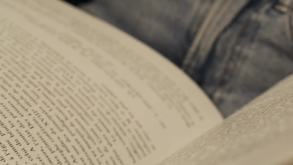 Hands turning the pages of a book