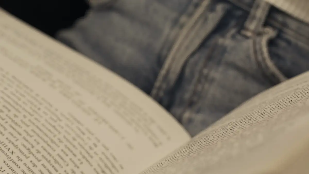 Hands turning the pages of a book