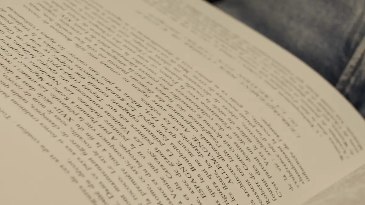 Hands turning the pages of a book