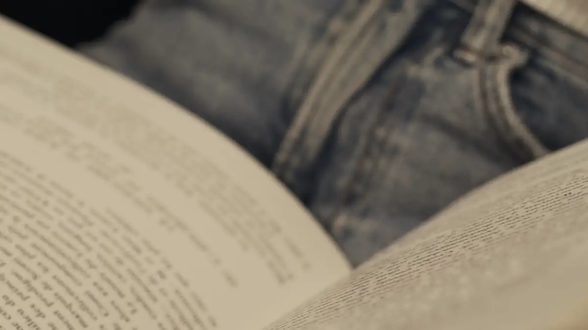 Hands turning the pages of a book