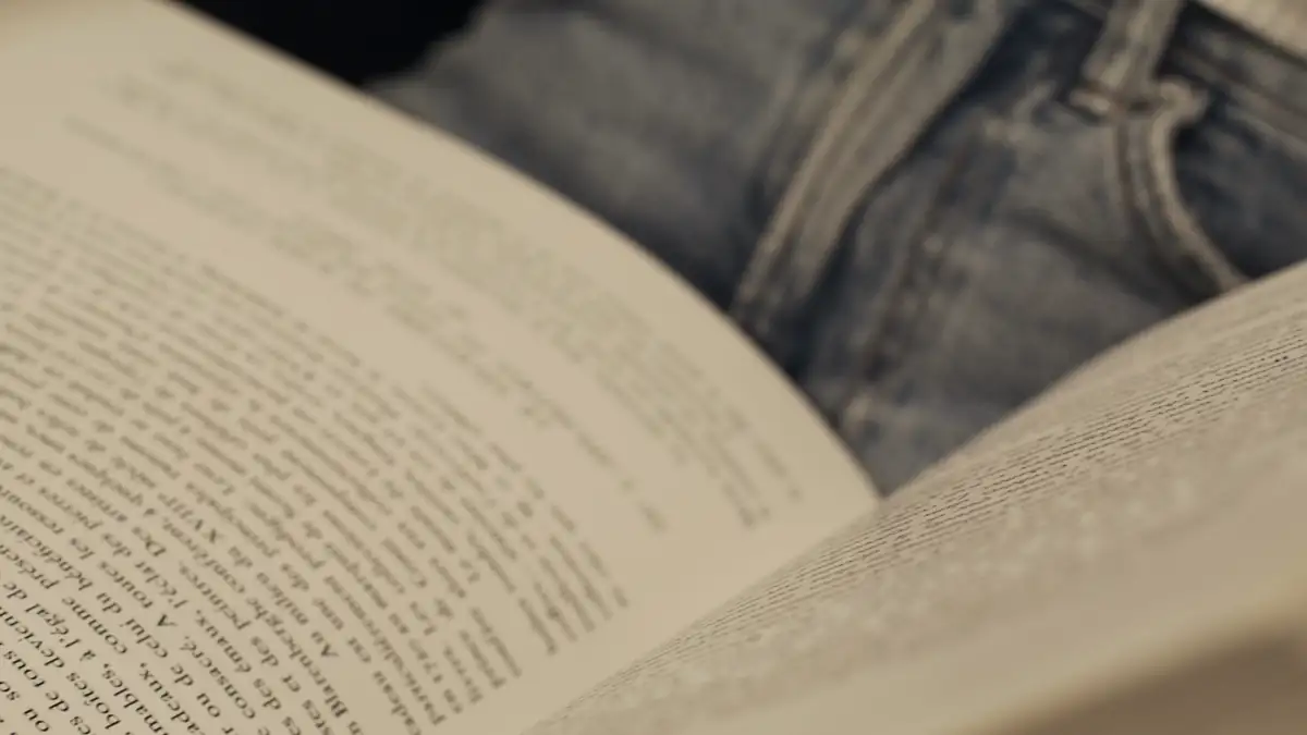Hands turning the pages of a book