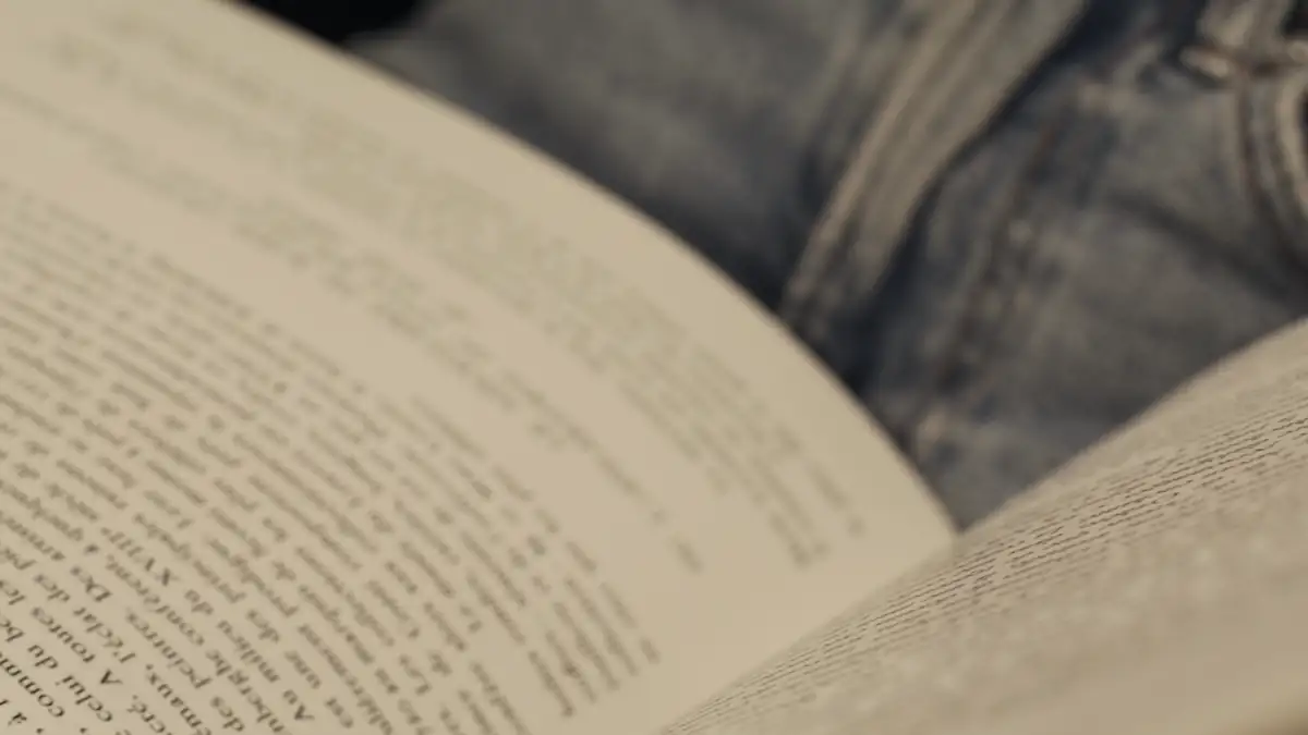 Hands turning the pages of a book