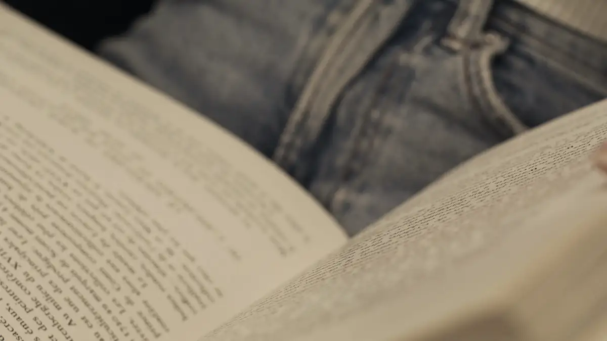 Hands turning the pages of a book