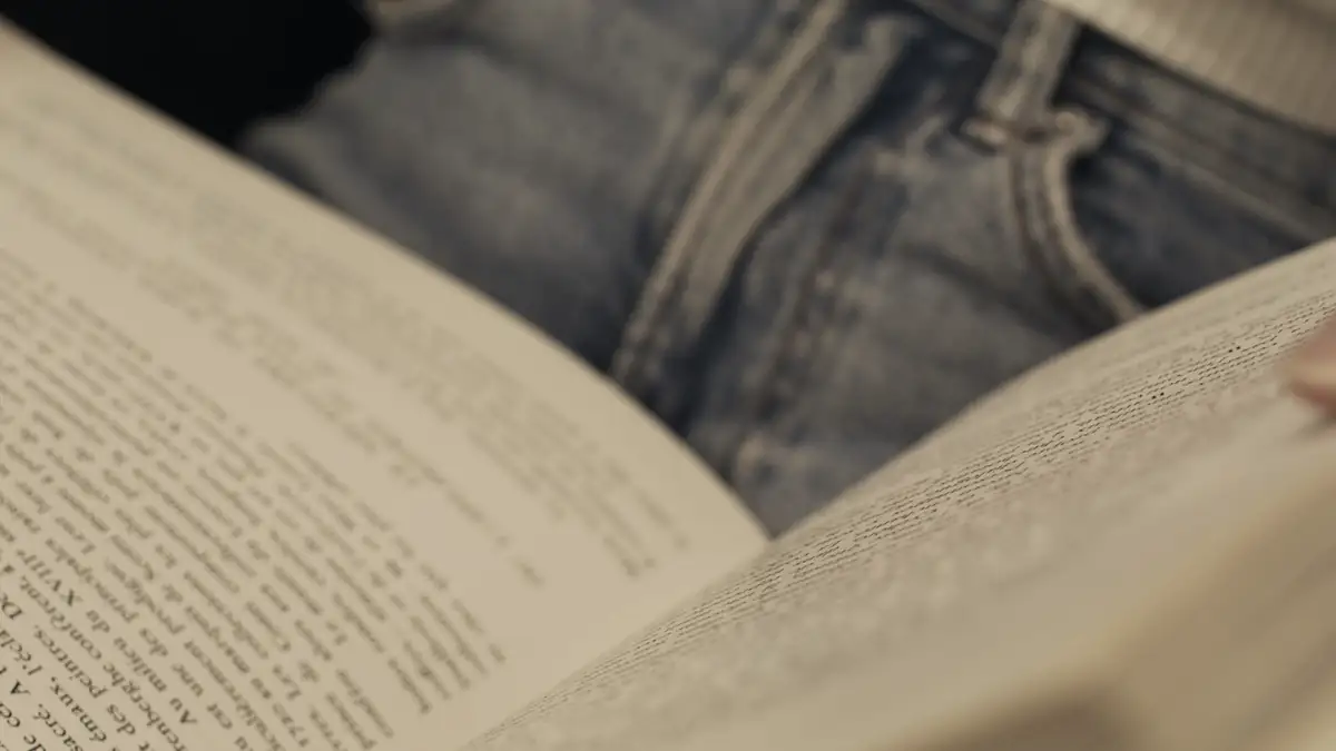 Hands turning the pages of a book